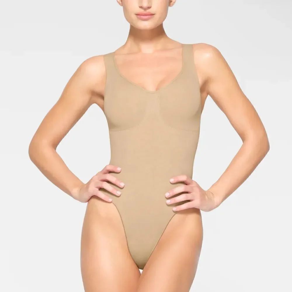 SKIMS Seamless Sculpt Scoop Neck Thong Bodysuit Shaping In Color Clay Nude